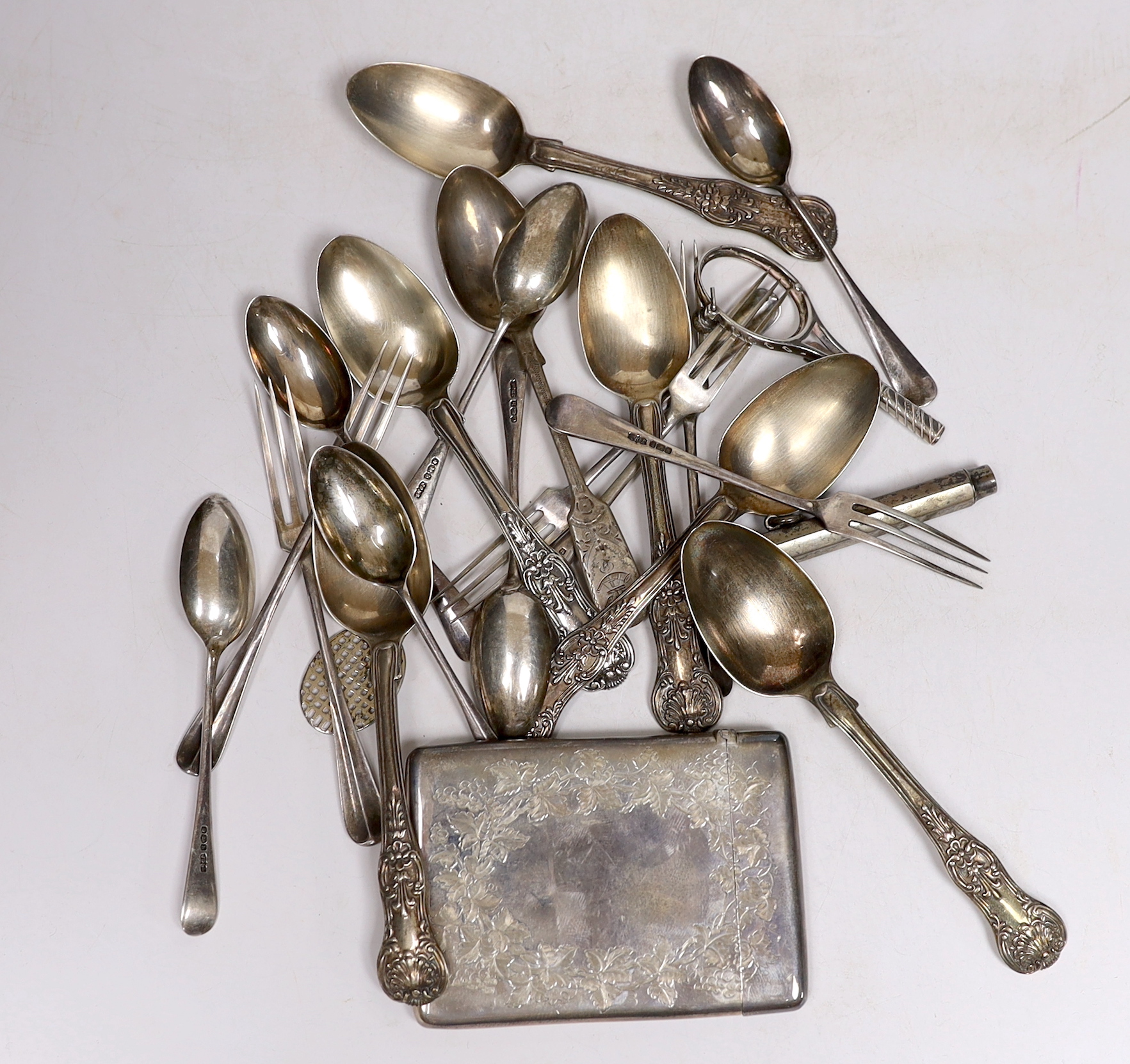 A late Victorian engraved silver rectangular card case, London, 1883, 9.9cm, eighteen items of assorted silver flatware including a set of six George IV silver Queens pattern teaspoons,1827/8, a silver pencil and a tenni